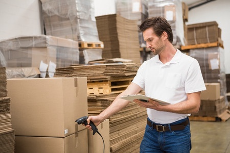 Man scanning package in warehouse